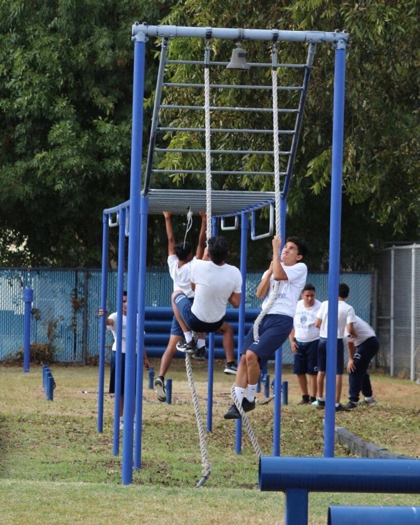 A Group of People Climbing a Monkey Bars