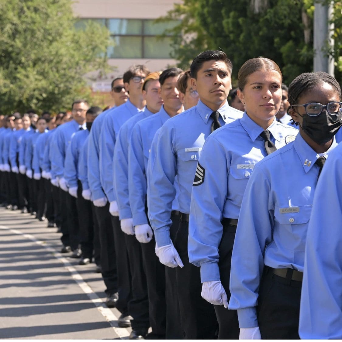 A Group of People in Uniform Standing in a Line